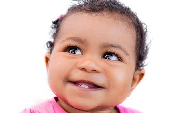 smiling toddler girl on white background