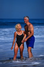 Picture of older couple playing on the beach