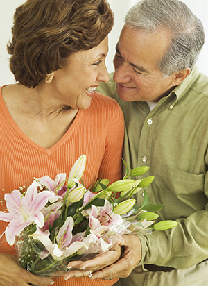 Wife receiving flowers from husband.