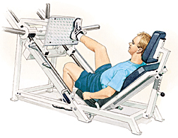 Man sitting in exercise machine with one foot on platform for leg presses.