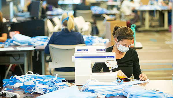 Team members sewing masks at the BayCare System Office