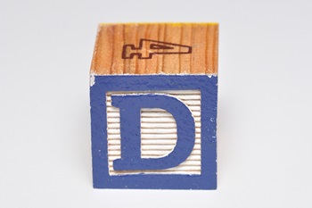 Alphabet block D on a white background