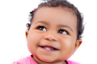 ethnic baby girl smiling