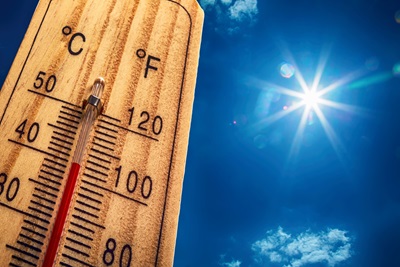 Thermometer displaying hot temperatures in sun summer day