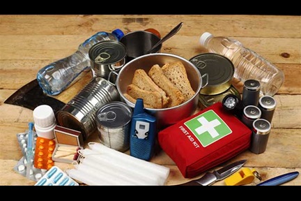 Items for a hurricane kit, including nonperishable food, utensils, medication, first aid kit, batteries, water, personal care items and other essentials.