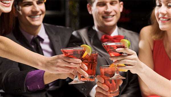 Friends toasting over cocktails