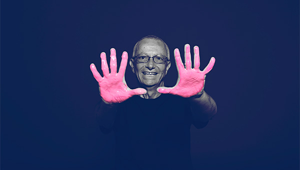 A senior man participates in the "It's in Our Hands" breast cancer awareness campaign.
