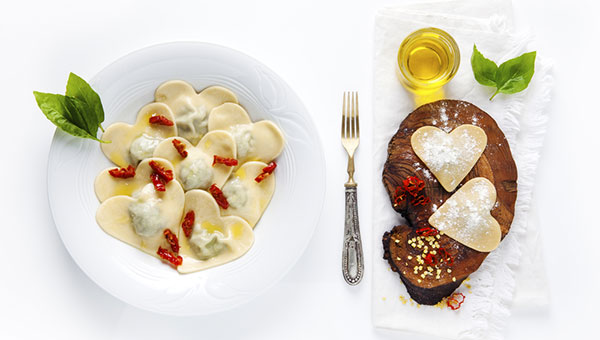 A Valentine's Day meal with heart-shaped pastas