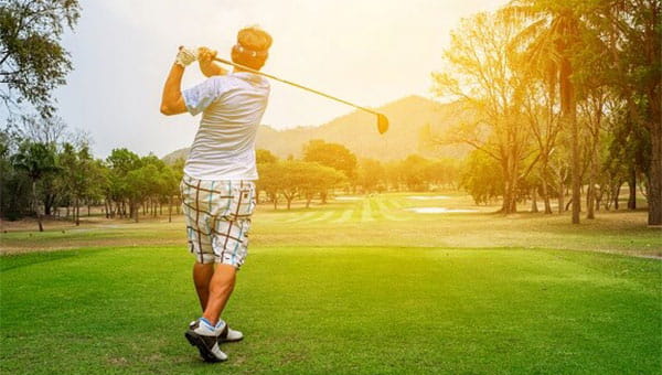 A person playing golf A person playing golf