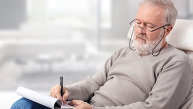 Elderly man filling out forms
