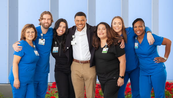 Career Paths at BayCare Group of BayCare team members standing together smiling for a photo.