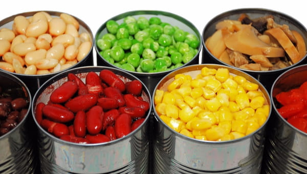 Close up of opened cans of vegetables
