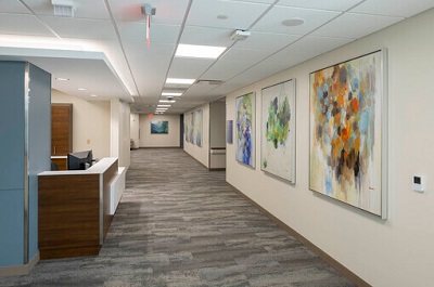 A hallway with paintings in Mease Countryside Hospital's Bilheimer Tower