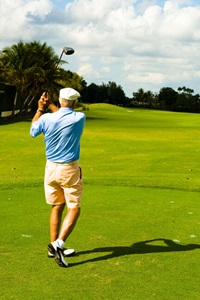 Senior man golfing