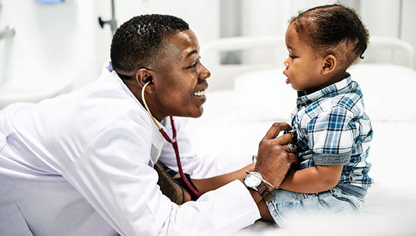 Physician examining baby