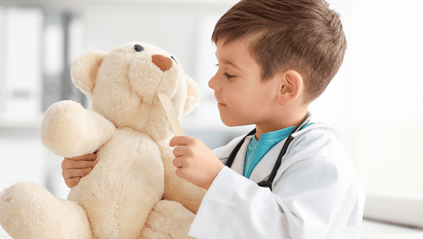 child holding a teddy bear