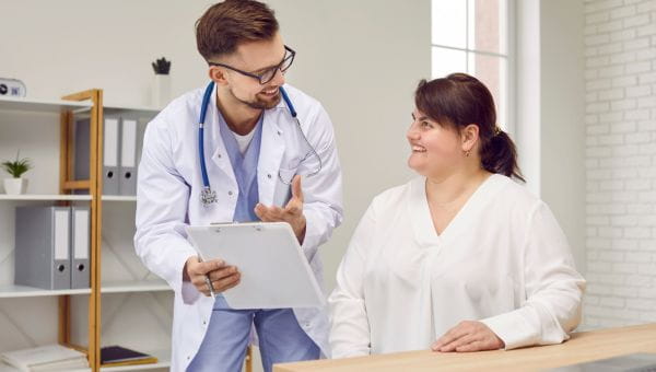 Overweight woman having consultation at doctor's office.