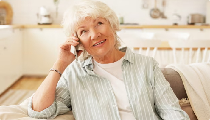 Lady smiling while talking on the phone