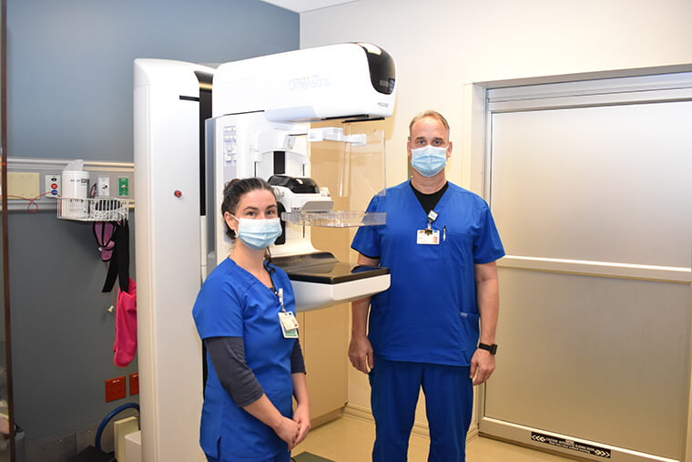 Two members of  St. Joseph's Hospital-North imaging staff next to the mammography machine