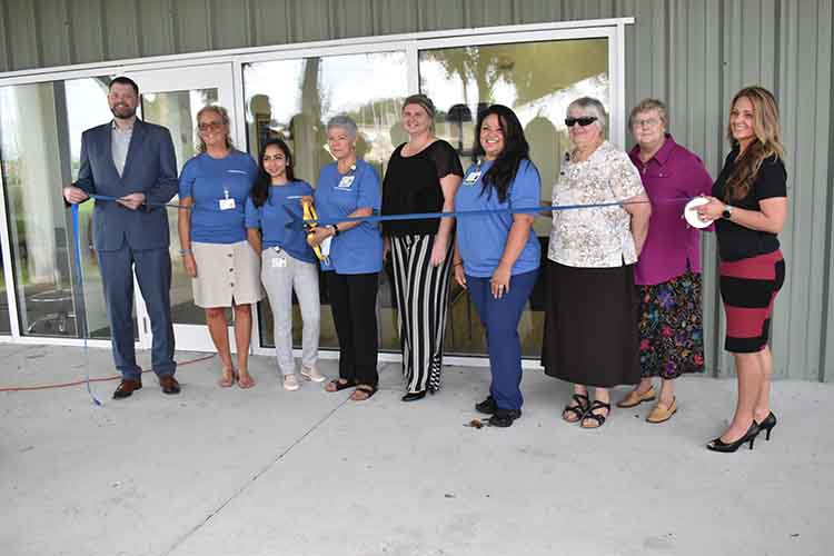 BayCare and Catholic Charities representatives cut the ribbon at La Esperanza