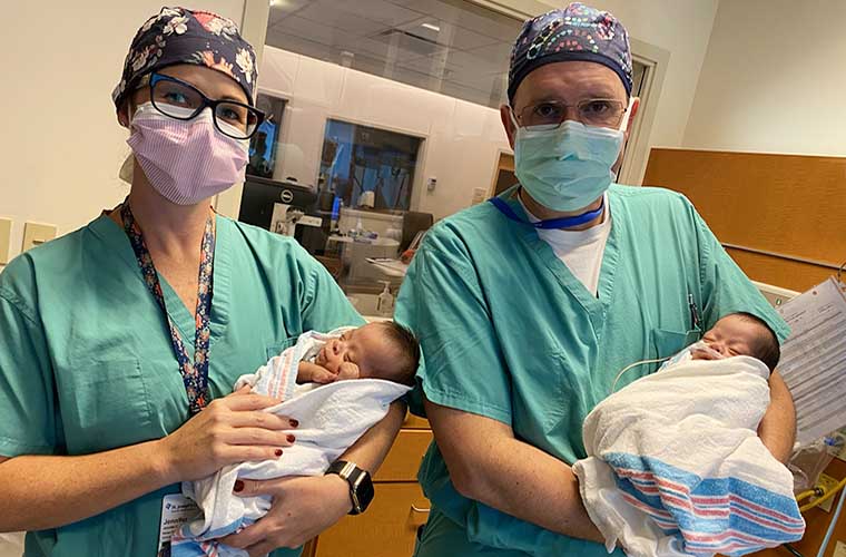Dr. Jeremy Ringewald, pediatric interventional cardiologist, and Jennifer Carter, APRN, with preemie twins who had heart procedure at St. Joseph's Children's Hospital