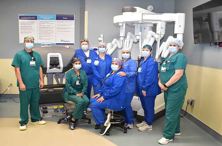 The St. Joseph's Hospital-South robotic surgery team with the robot