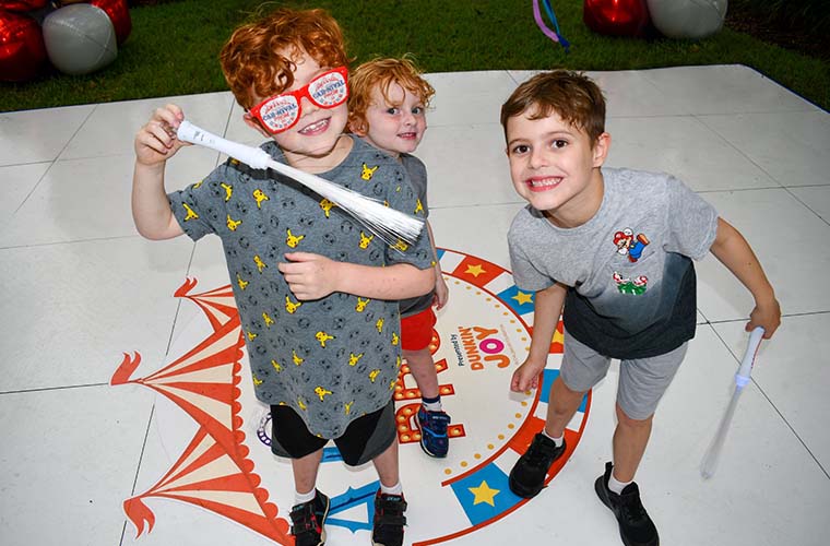 Pediatric patient and his brothers have fun at St. Joseph's Children's Hospital's carnival-themed prom.