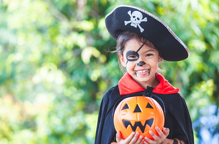 Child wearing pirate costume for Halloween celebration