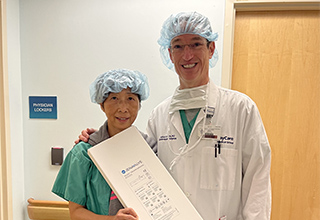 Interventional cardiologist Lang Lin, MD, and cardiovascular surgeon Joshua Rovin, MD, FACS, stand together after becoming the first in Florida to use TAVR to treat aortic regurgitation.