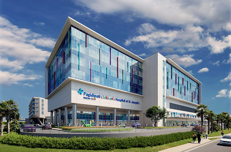 Rendering of the future Pagidipati Children’s Hospital, a modern multi‑story building with colorful window accents and a bright, open design.