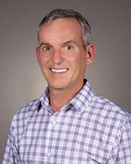 A headshot photo of Jason Fields.
