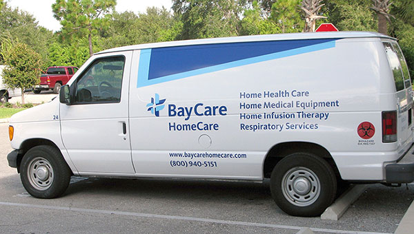 A BayCare HomeCare van parked in a parking lot