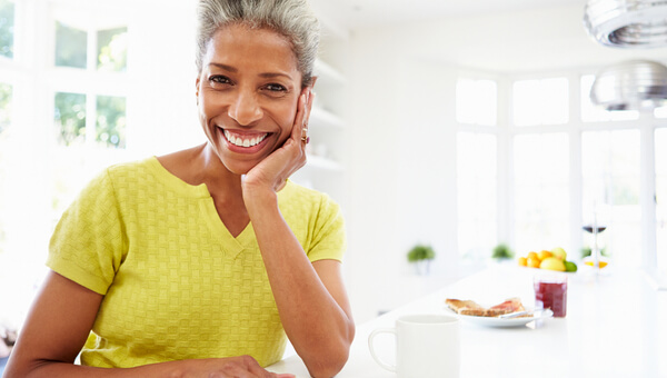 woman smiling in her kitchen