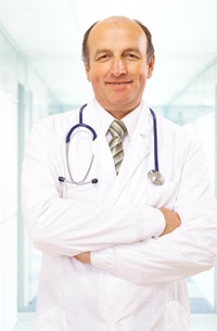 male physician in a white coat with his arms crossed