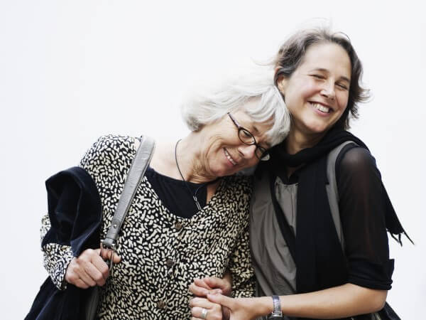 Two ladies hugging