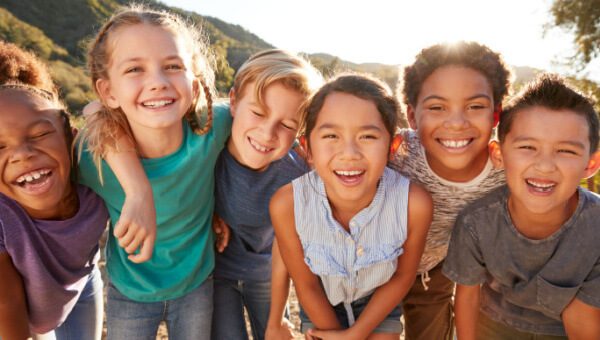 A group of six smiling children.