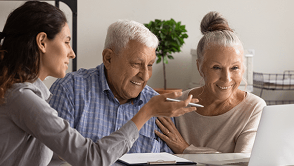 Find Accepted Insurance Plans at BayCare Woman consultant advises elderly spouses good medical life health insurance on a computer.