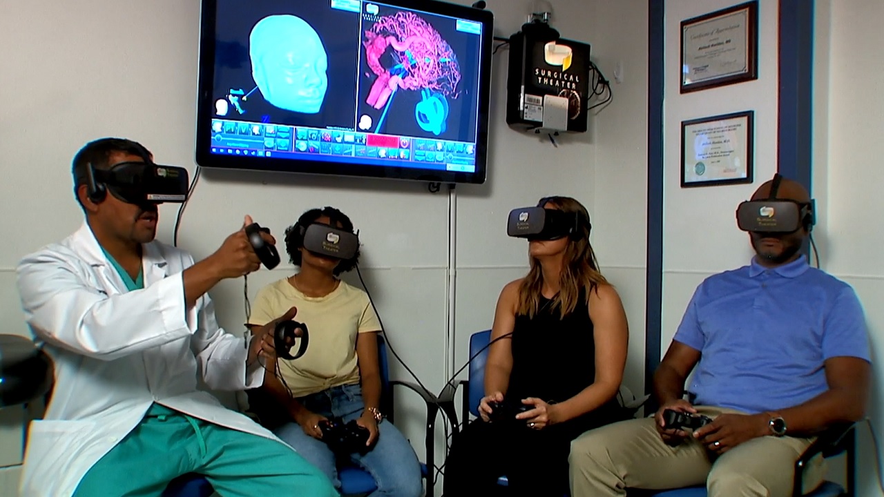 Dr. Haridas, Arion and her parents use the virtual reality medical technology at St. Joseph's Children's Hospital.