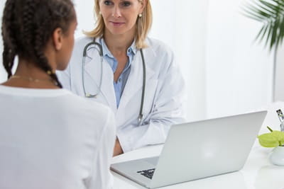 Female doctor with a female patient